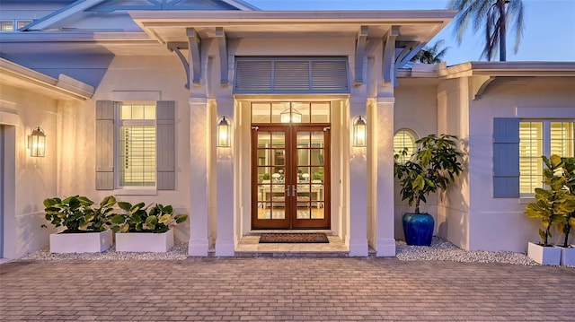 1530 Pine Bay Dr, Sarasota, FL 34231 - property entrance with french doors and stucco siding