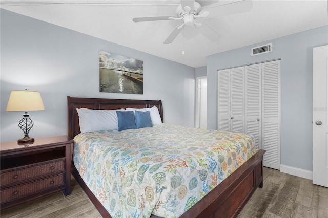 6310 Midnight Pass Rd Unit 405N, Sarasota, FL 34242 - bedroom featuring wood finished floors, a closet, and a ceiling fan