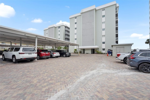 6310 Midnight Pass Rd Unit 405N, Sarasota, FL 34242 - view of property featuring covered and uncovered parking
