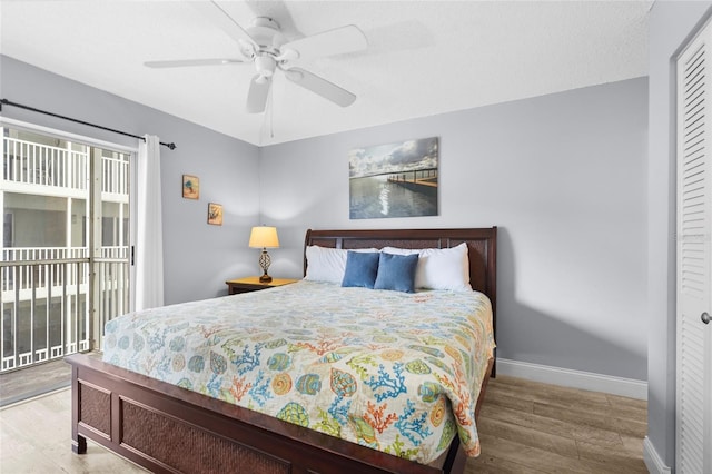 6310 Midnight Pass Rd Unit 405N, Sarasota, FL 34242 - bedroom with access to exterior, wood finished floors, a closet, and ceiling fan