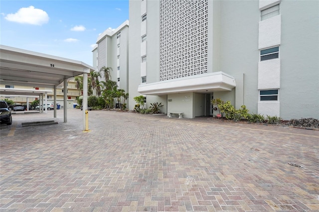 6310 Midnight Pass Rd Unit 405N, Sarasota, FL 34242 - view of building exterior with covered parking