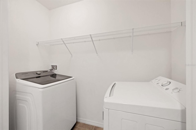 6454 Baytown Dr, Sarasota, FL 34240 - laundry room featuring washer and clothes dryer and baseboards