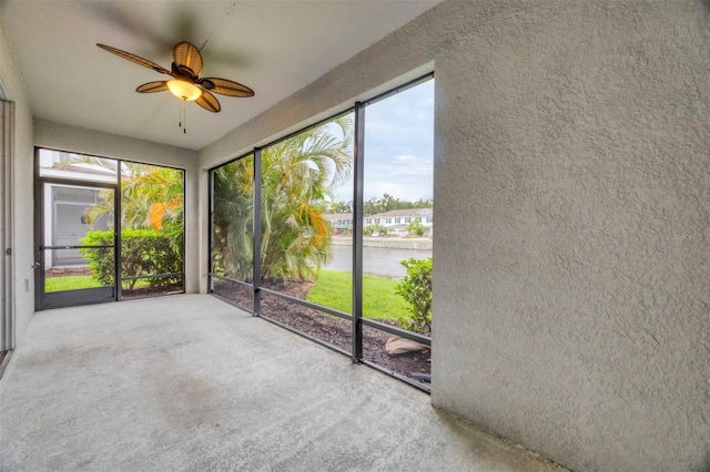 6454 Baytown Dr, Sarasota, FL 34240 - unfurnished sunroom with a ceiling fan and a water view
