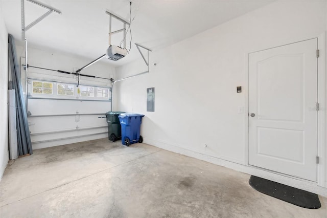 6454 Baytown Dr, Sarasota, FL 34240 - garage with electric panel and a garage door opener