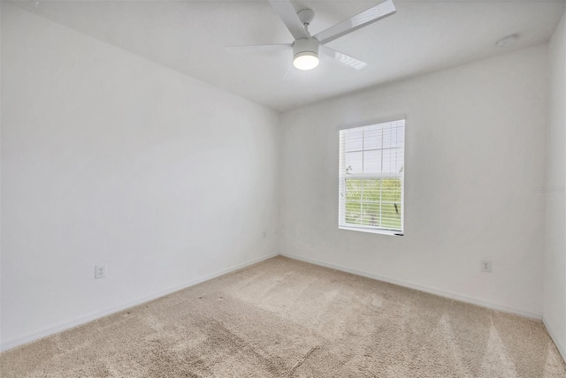 6454 Baytown Dr, Sarasota, FL 34240 - spare room featuring light colored carpet and a ceiling fan