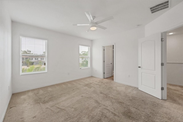 6454 Baytown Dr, Sarasota, FL 34240 - unfurnished bedroom featuring carpet floors and a ceiling fan