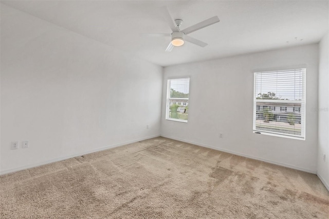 6454 Baytown Dr, Sarasota, FL 34240 - empty room with carpet flooring and a ceiling fan