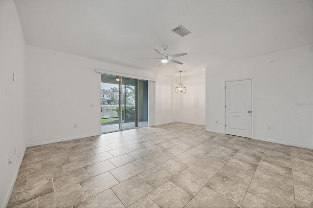 6454 Baytown Dr, Sarasota, FL 34240 - empty room featuring ceiling fan and a chandelier