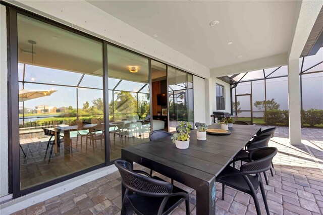 16418 Slate Pl, Lakewood Ranch, FL 34211 - sunroom / solarium featuring outdoor dining space