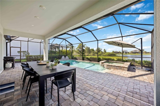 16418 Slate Pl, Lakewood Ranch, FL 34211 - view of patio / terrace featuring a water view, a pool with connected hot tub, a lanai, and area for grilling