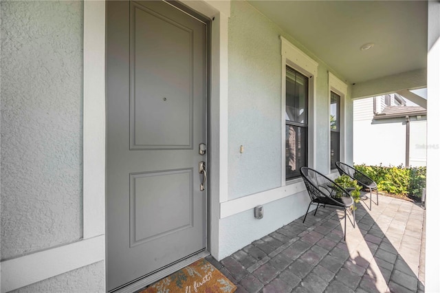 16418 Slate Pl, Lakewood Ranch, FL 34211 - property entrance featuring stucco siding and a porch