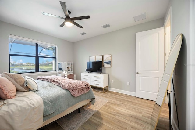 16418 Slate Pl, Lakewood Ranch, FL 34211 - bedroom with light wood-style floors and a ceiling fan