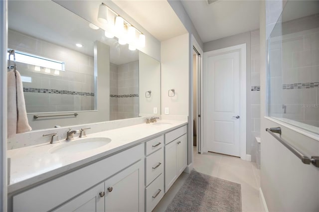 16418 Slate Pl, Lakewood Ranch, FL 34211 - bathroom featuring double vanity and tile patterned floors