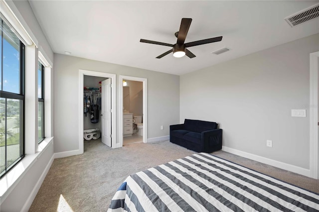 16418 Slate Pl, Lakewood Ranch, FL 34211 - unfurnished bedroom featuring carpet flooring, a spacious closet, a ceiling fan, and ensuite bath