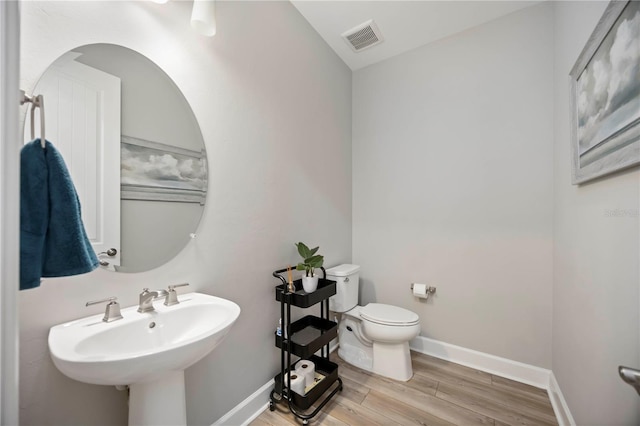 16418 Slate Pl, Lakewood Ranch, FL 34211 - bathroom with toilet and wood finished floors