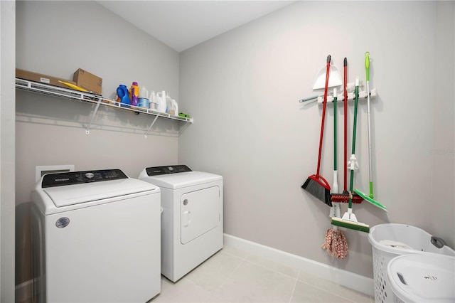 16418 Slate Pl, Lakewood Ranch, FL 34211 - washroom featuring separate washer and dryer and light tile patterned floors