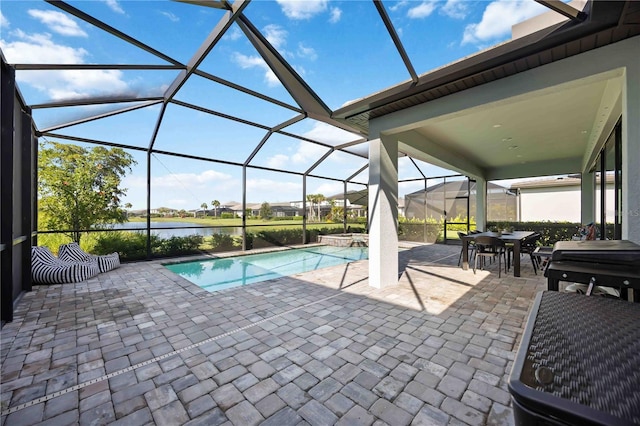 16418 Slate Pl, Lakewood Ranch, FL 34211 - view of swimming pool with a patio, a water view, glass enclosure, and a pool with connected hot tub