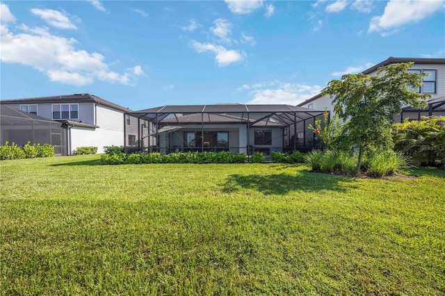 16418 Slate Pl, Lakewood Ranch, FL 34211 - back of house featuring a yard and a lanai