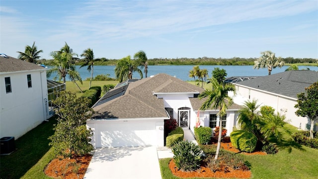 5078 47th St W, Bradenton, FL 34210 - view of front of property with a garage, concrete driveway, a water view, a shingled roof, and a lanai