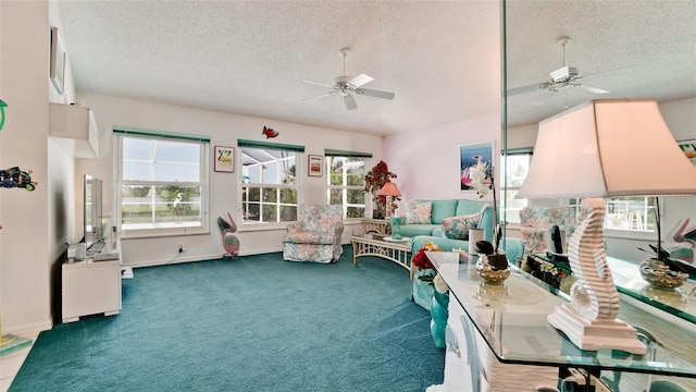 5078 47th St W, Bradenton, FL 34210 - living area featuring a ceiling fan, a textured ceiling, healthy amount of natural light, and carpet flooring