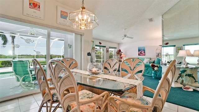 5078 47th St W, Bradenton, FL 34210 - dining room with ceiling fan, light tile patterned flooring, a chandelier, and a textured ceiling