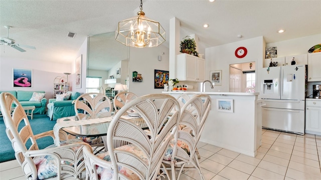 5078 47th St W, Bradenton, FL 34210 - dining area featuring plenty of natural light, a chandelier, light tile patterned floors, a ceiling fan, and recessed lighting
