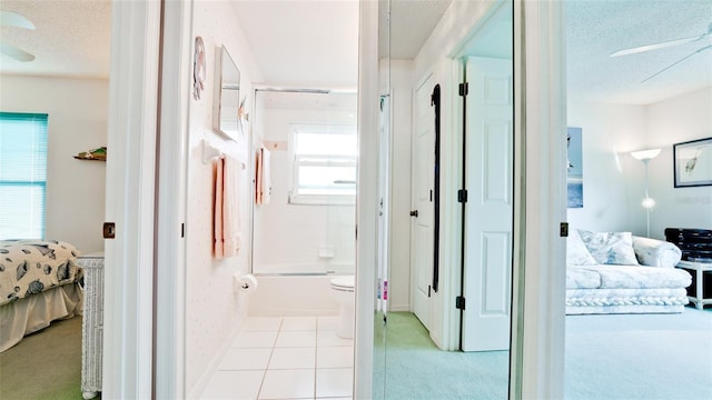 5078 47th St W, Bradenton, FL 34210 - corridor featuring a textured ceiling, light tile patterned floors, and light colored carpet
