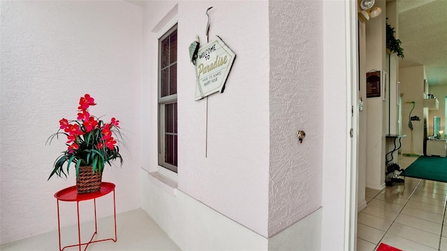 5078 47th St W, Bradenton, FL 34210 - hallway with tile patterned flooring and a textured wall