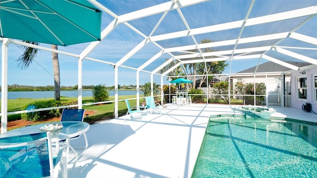 5078 47th St W, Bradenton, FL 34210 - view of pool featuring a patio area, glass enclosure, a water view, and a pool with connected hot tub
