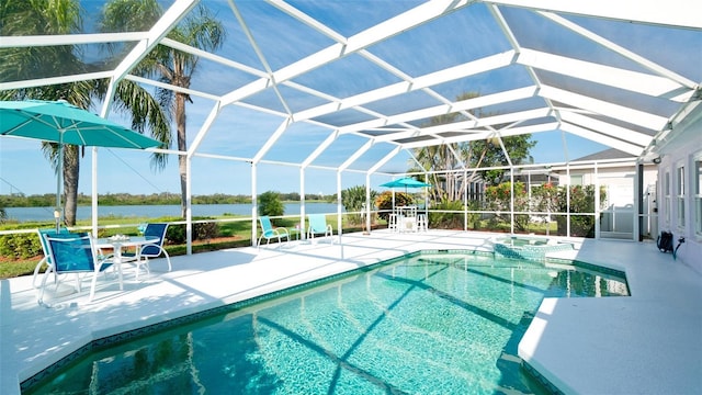5078 47th St W, Bradenton, FL 34210 - view of swimming pool featuring a patio area, a water view, a pool with connected hot tub, and glass enclosure
