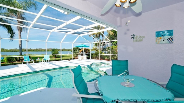 5078 47th St W, Bradenton, FL 34210 - view of swimming pool with a patio area, a ceiling fan, a water view, a lanai, and a pool with connected hot tub