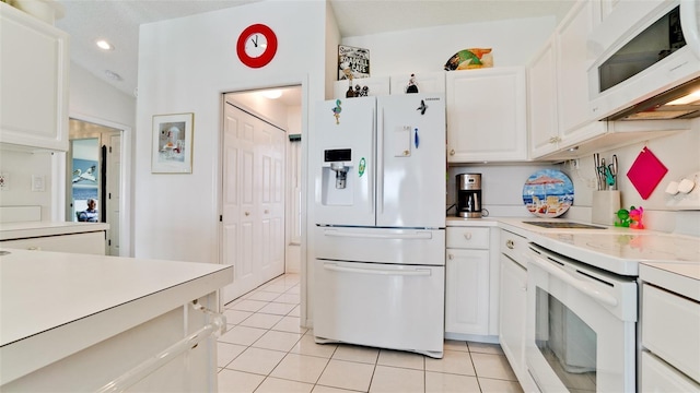 5078 47th St W, Bradenton, FL 34210 - kitchen featuring white appliances, light tile patterned floors, white cabinetry, light countertops, and recessed lighting