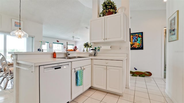 5078 47th St W, Bradenton, FL 34210 - kitchen featuring white dishwasher, a peninsula, pendant lighting, light countertops, and white cabinetry