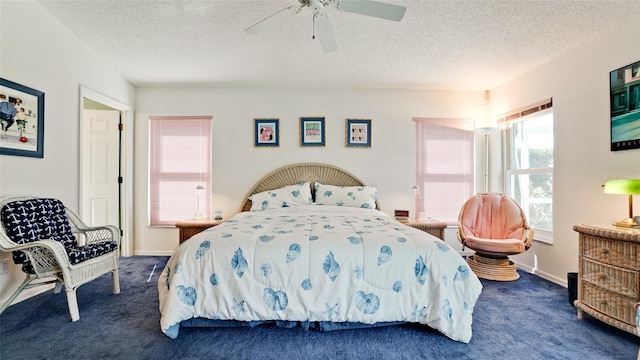 5078 47th St W, Bradenton, FL 34210 - bedroom with dark colored carpet, a textured ceiling, and a ceiling fan