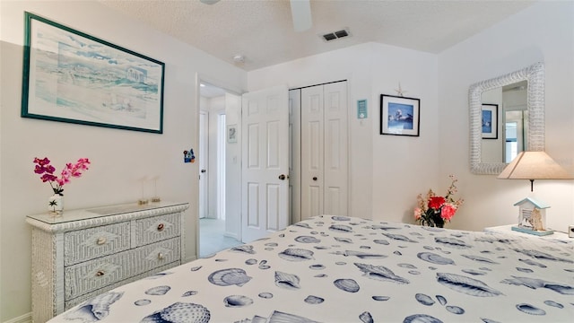 5078 47th St W, Bradenton, FL 34210 - bedroom with a closet, a textured ceiling, and a ceiling fan