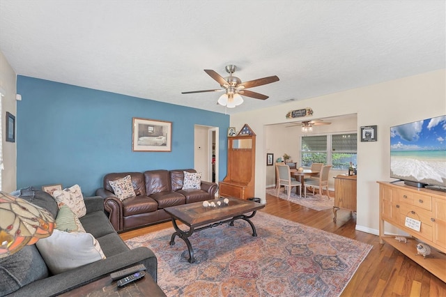 401 N Jefferson Ave, Sarasota, FL 34237 - living room featuring ceiling fan and wood finished floors