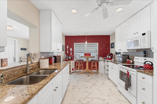 401 N Jefferson Ave, Sarasota, FL 34237 - kitchen featuring white appliances, ceiling fan, tasteful backsplash, light marble finish floors, and recessed lighting