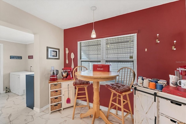 401 N Jefferson Ave, Sarasota, FL 34237 - dining area featuring light marble finish flooring and baseboards