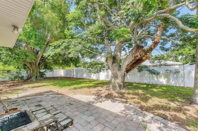 401 N Jefferson Ave, Sarasota, FL 34237 - fenced backyard with a patio area