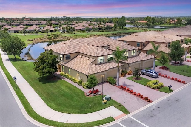 6512 Grand Estuary Trl Unit 101, Bradenton, FL 34212 - aerial view at dusk of a water view and a residential view