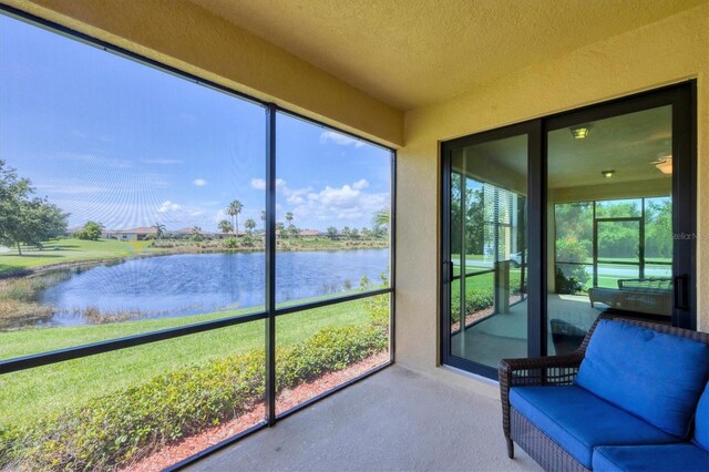 6512 Grand Estuary Trl Unit 101, Bradenton, FL 34212 - sunroom / solarium featuring a water view