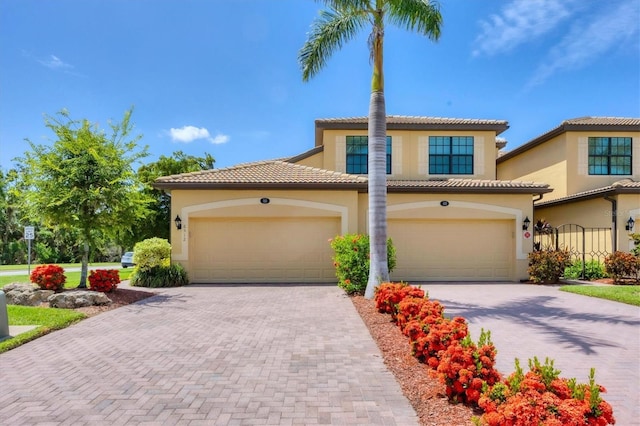 6512 Grand Estuary Trl Unit 101, Bradenton, FL 34212 - mediterranean / spanish house with decorative driveway, stucco siding, and a tiled roof