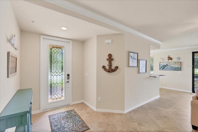 6512 Grand Estuary Trl Unit 101, Bradenton, FL 34212 - entrance foyer with light tile patterned floors and ornamental molding