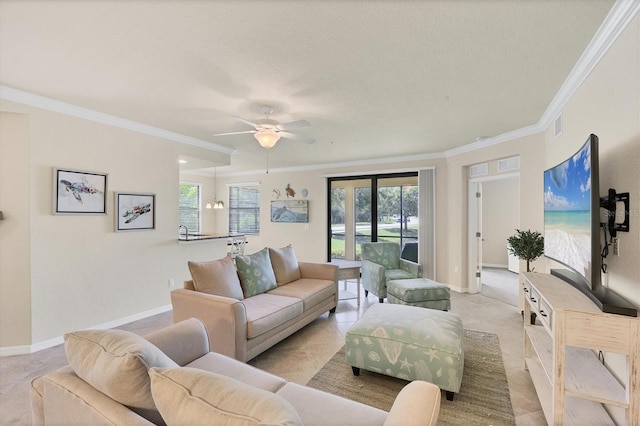 6512 Grand Estuary Trl Unit 101, Bradenton, FL 34212 - living area with crown molding, healthy amount of natural light, a ceiling fan, a textured ceiling, and light tile patterned floors