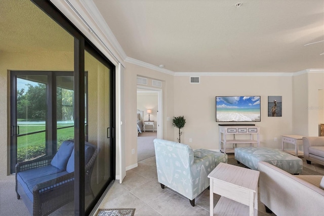 6512 Grand Estuary Trl Unit 101, Bradenton, FL 34212 - living area featuring ornamental molding and light tile patterned floors