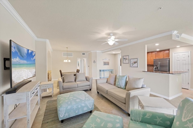 6512 Grand Estuary Trl Unit 101, Bradenton, FL 34212 - living area with crown molding, light tile patterned flooring, a textured ceiling, a ceiling fan, and a chandelier