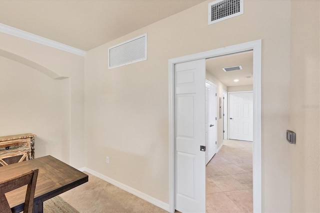 6512 Grand Estuary Trl Unit 101, Bradenton, FL 34212 - hall with light tile patterned floors and crown molding