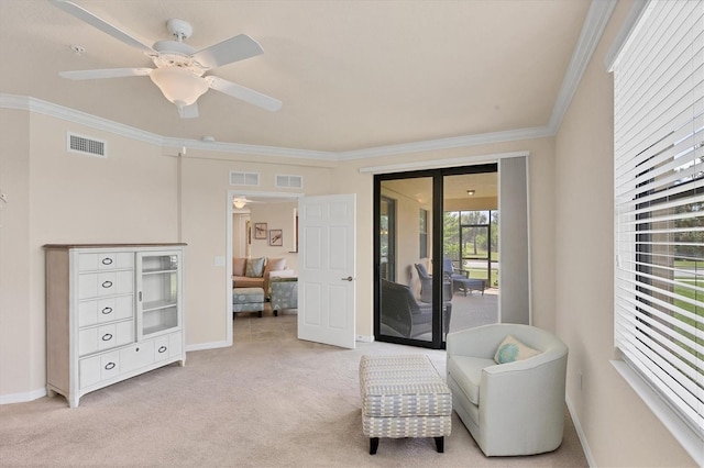 6512 Grand Estuary Trl Unit 101, Bradenton, FL 34212 - living area with crown molding, ceiling fan, and light carpet