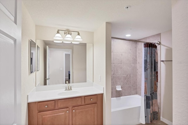 6512 Grand Estuary Trl Unit 101, Bradenton, FL 34212 - bathroom with vanity, shower / bathtub combination with curtain, and a textured ceiling