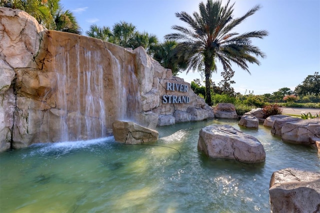 6512 Grand Estuary Trl Unit 101, Bradenton, FL 34212 - community sign featuring a small pond